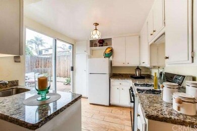 Open bright kitchen w/granite counters & stainless