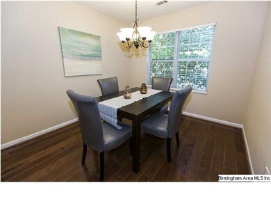 Separate dining room off of the kitchen with hardw