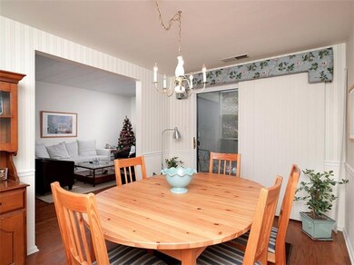 The dining room offers a chair rail and continued 