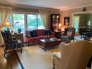 LIVING ROOM WITH WOOD BURNING FIREPLACE