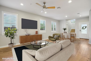 Living area featuring recessed lighting, baseboar