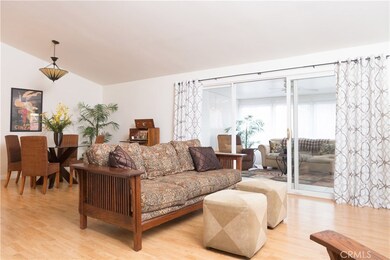 Large living room and attached dining space, room for a large family to relax.
