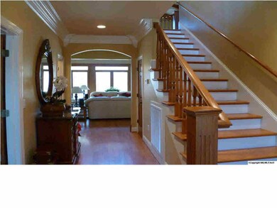 As you enter the Foyer, quality construction is evident even in the construction of the staircase.