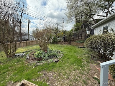 View of yard featuring fence