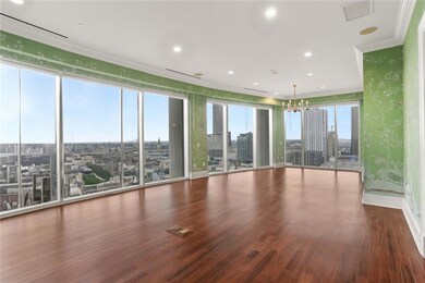 Expansive Primary Suite with wall to wall floor to