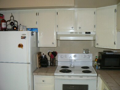 kitchen, refrigerator, range, washer and dryer con