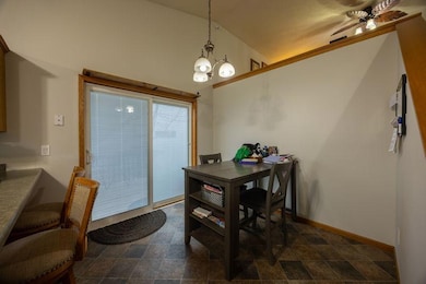 Dining room with sliding doors to outdoor deck.