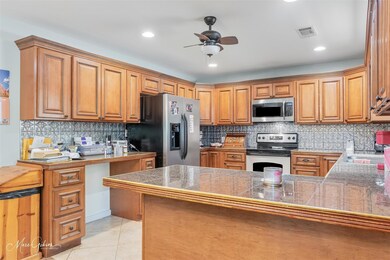 Kitchen featuring tasteful backsplash, a ceiling f