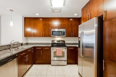 Kitchen with stainless steel appliances, tile floo