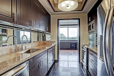 Kitchen includes granite counter tops with stainle