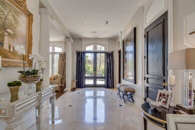 Marble Floors greet your guests along with high ce