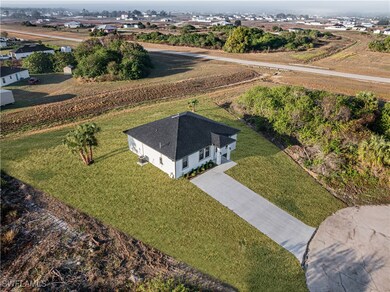 Birds eye view of property featuring a rural view