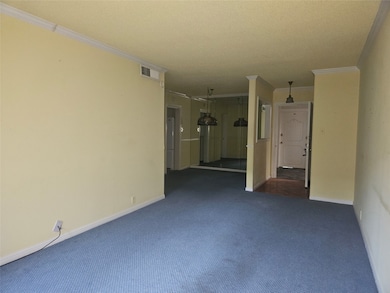 living room looking to dining and kitchen