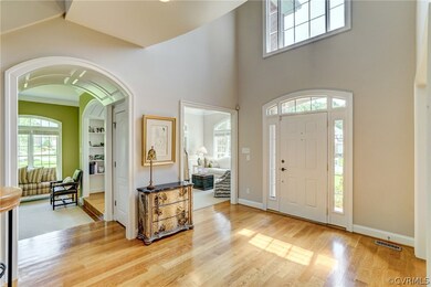 Beautiful 2-story Foyer with arched glass over doo