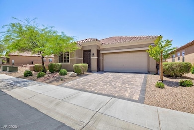Mediterranean / spanish house with a garage, a til