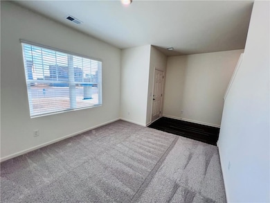 Spare room with carpet floors