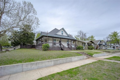 View of front of property with covered porch and a