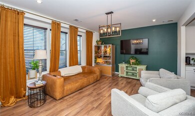 Living room with an inviting chandelier and light