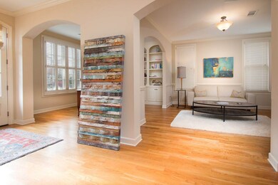 A look from the foyer into the living room and din