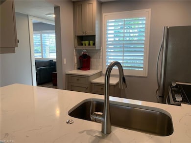Kitchen featuring a healthy amount of sunlight, gr