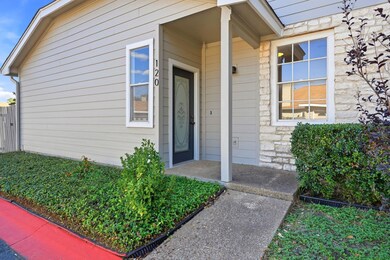 View of exterior entry featuring stone siding