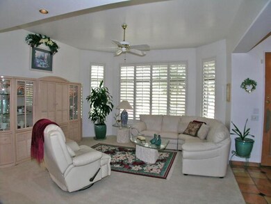 living room with bay windows & shutters