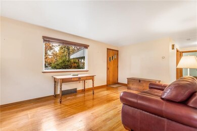 Spacious living room with hardwood floors.