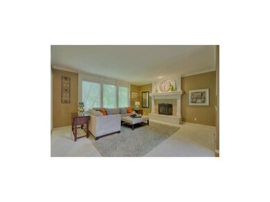 Bright & spacious great room with fireplace.