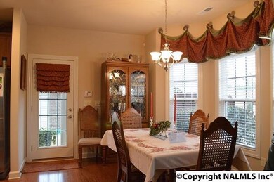 Room for hutch and dining table in bay window.