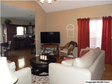 ANOTHER VIEW OF THE GREATROOM OPENING INTO DINING AND KITCHEN