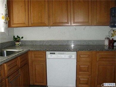 Remodeled kitchen with granite counter tops