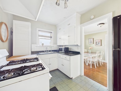 Efficiency Kitchen with Gas Range, Dishwasher & Fridge