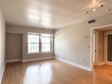 Unfurnished room featuring light wood-style floors and baseboards