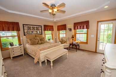 Master bedroom en suite with door leading to hot t