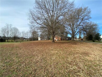 VIEW OF HOME FROM ROAD WITH OUTBUILDING TO THE LEF