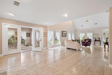 living room opens to sunroom