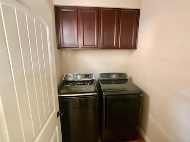Laundry room featuring washing machine and dryer,