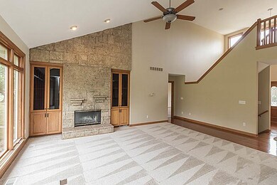 Vaulted Living Room w/ Floor to Ceiling Stone Fire
