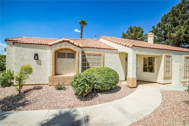 Mediterranean / spanish-style home featuring a til