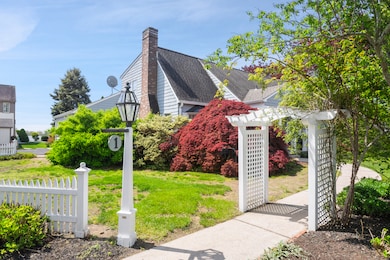 Charming front entry with garden arbor