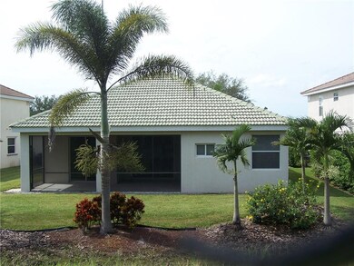 Rear elevation with covered screened lania.