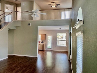 Unfurnished living room with a ceiling fan, dark 