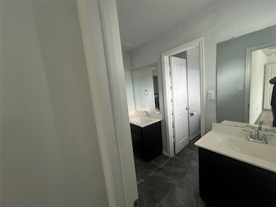 Bathroom featuring two vanities