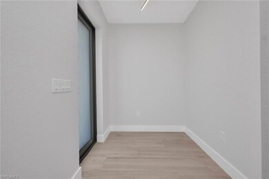 Spare room featuring light wood-type flooring and 