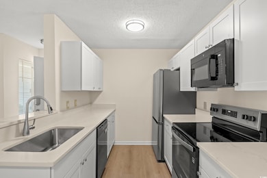 Kitchen featuring appliances with stainless steel 