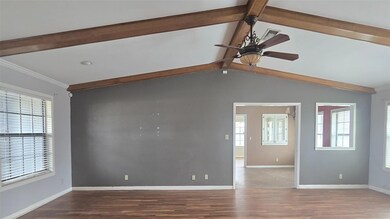 Spare room featuring ornamental molding, lofted ce