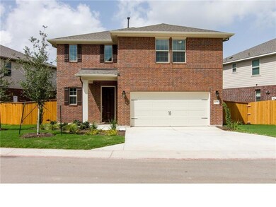 Traditional-style home with concrete driveway, br