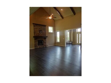 Great Room Features Wood Beams and Vaulted Ceiling