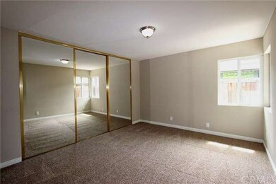 Master bedroom with mirror closet doors