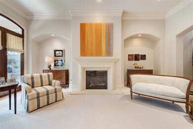 [Living Room]
A closer view of the stone fireplace in the living room. Note arched wall recesses for furniture and art display.